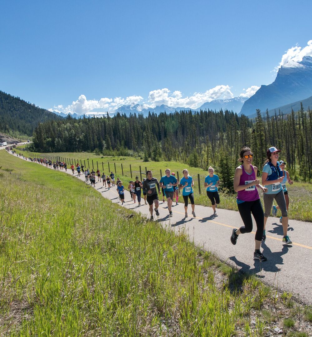 People running along the legacy trail in Banff for the Banff Marathon